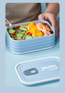 Close-up of portable 304 stainless steel lunch box with salad and shrimp inside
