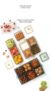 Detail of luxury partitioned fruit box with gold handle lids and amber transparent containers