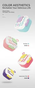 Macro view of portable dual-layer lunch boxes in various vibrant color combinations