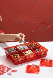 Detail of red acrylic 6-compartment snack tray with gold double happiness character
