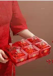 Detail of red transparent candy tray with six removable compartments and crystal handles