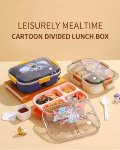 Detail of four-compartment lunch box with cartoon lids, cutlery and sauce container