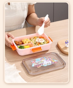 Detailed view of pink 3-compartment bento box with unicorn lid and reusable spork