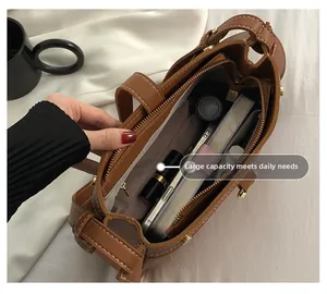 Top view of brown leather bag interior with large capacity and organized compartments