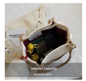 Detailed view of spacious interior compartments for tote bag with organized daily essentials