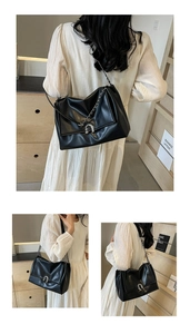 Detailed views of a black faux leather underarm bag with silver chain and metal buckle