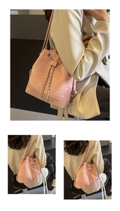 Pink drawstring bucket backpack shown in versatile crossbody and double-shoulder styles