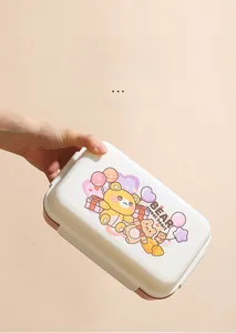 Detail of leak-proof pink lunch box showing secure side buckle seal and cute bear pattern