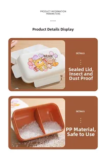 Detail view of double-layer lunch box with orange compartments and a cute bear design