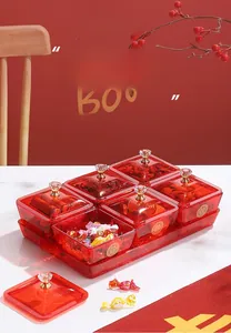 Close-up of a red 6-compartment candy box set with gold double happiness characters