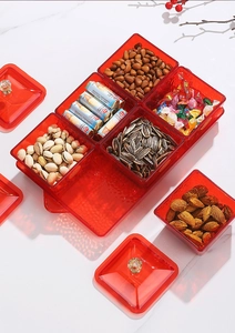 Macro shot of red translucent divided snack tray with six compartments and crystal lid