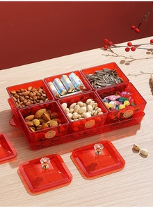 Detail of red transparent candy tray with six compartments and gold Xi character