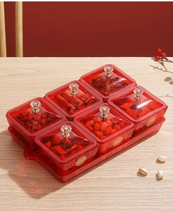 Close-up of red transparent divided snack boxes with golden Double Happiness symbols