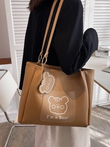 Brown faux leather tote bag with minimalist cartoon bear pattern and shoulder strap