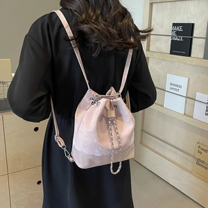 Pink drawstring bucket backpack with marble texture and delicate gold chain straps