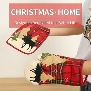 Detail of Christmas plaid oven mitt and pot holder set with reindeer and tree embroidery