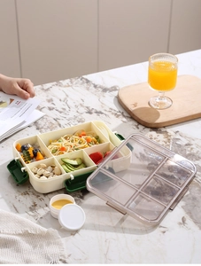 Top view of five-compartment microwave lunch box with leak-proof lid and sauce container