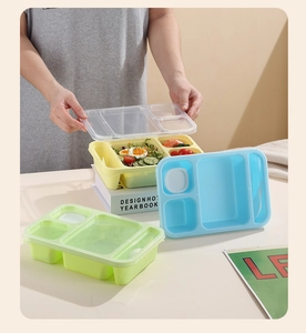Three-grid stackable plastic bento box set with translucent lids and cutlery slots