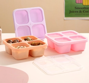 Detail of four-compartment snack bento box set with transparent lids for food storage