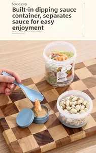 Detail of 560ml+310ml double-layer salad cup with built-in sauce container and spoon