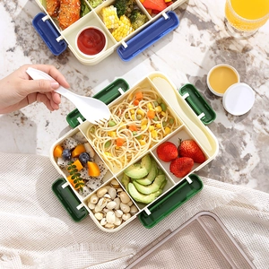 Divided lunch box with cutlery set, featuring five compartments on marble surface