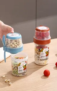 Close-up of portable blue and orange salad cups with separate compartments for yogurt and oats