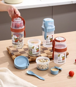 Dual-layer portable salad cup with storage for yogurt, oatmeal, and a side utensil