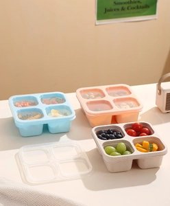 Detail of multi-compartment bento box layers showing healthy food portion separation