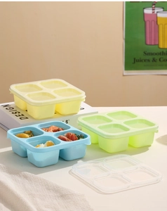 Detailed view of silicone stackable bento box with four compartments and transparent lid