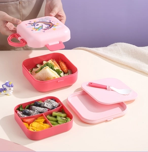 Three-layer pink unicorn lunch box with separate food sections and carrying handle