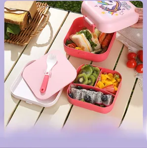 Close-up of pink double-layer unicorn bento box with divided sections for picnic use
