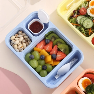 Stacked blue multi-compartment bento lunch box set with folding cutlery and sauce container