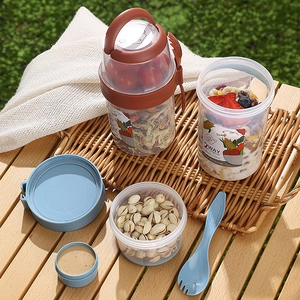 Portable 2-tier salad cup with blue and brown lids, fork spoon and dressing container