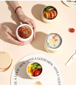 Detail of portable insulated stainless steel soup cups with leakproof lids and handles