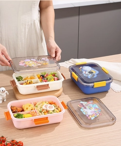 Detail showing the snap-lock lid with cartoon bear and astronaut patterns on bento boxes