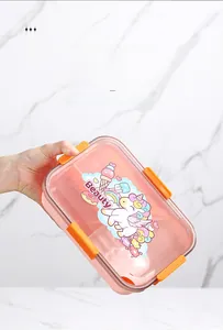 Pink bento box with unicorn graphics and four secure orange latches on a white surface