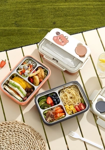 Boîtes à bento en acier inoxydable à compartiments avec décors d'ours sur une table