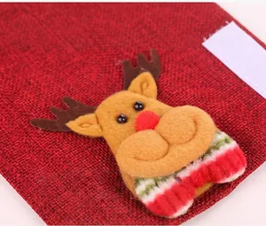 Detail of Christmas burlap handle cover featuring a 3D plush reindeer with Velcro closure