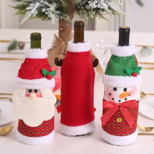 Three-piece Christmas wine bottle covers featuring Santa, reindeer, and snowman designs