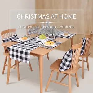 Close-up of black and white buffalo plaid table runner and matching chair cushion set