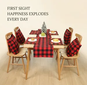 Close-up of red and black buffalo plaid table runner and placemat for Christmas decor