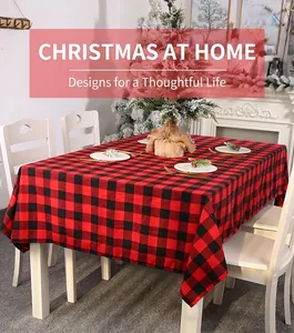 Close-up of red and black buffalo plaid Christmas tablecloth in a cozy dining setting