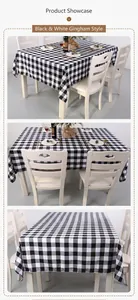 Detailed view of black and white plaid tablecloth with elegant drape on rectangular table
