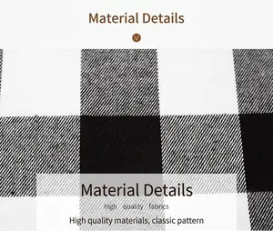 Macro view of high-quality fabric texture showing classic black and white plaid pattern