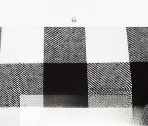 Macro view of high-quality fabric texture showing classic black and white plaid pattern