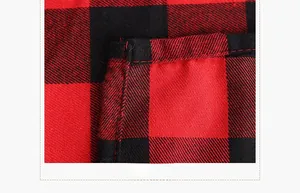 Macro detail of red and black buffalo plaid tablecloth with reinforced stitching