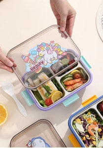 Détail de la boîte bento en acier à 3 compartiments avec couvercle licorne et repas