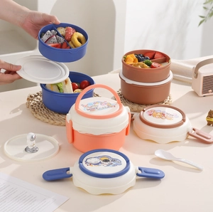 Detailed view of stackable round bento boxes with secure side latches and top handles