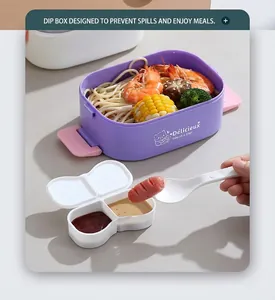 Detail of purple bento box showing dip container and spoon with noodles and shrimp