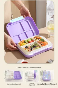 Close-up of multi-compartment lunch box with cartoon astronaut lid and sealing ring